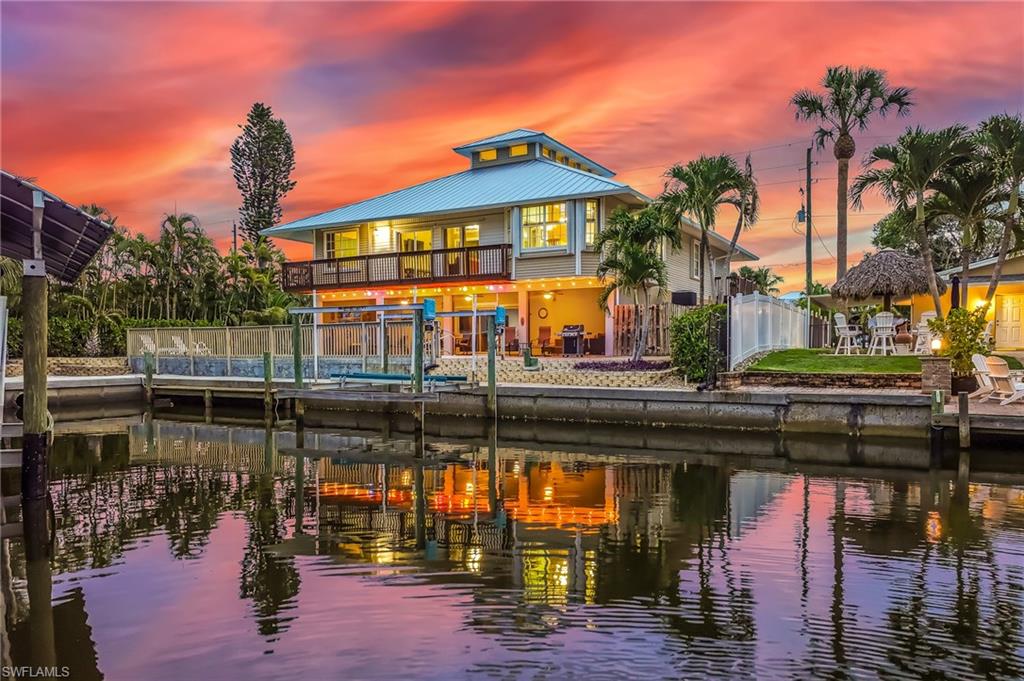 TRUE FLORIDIAN FISHERMAN’S / BOATER’S PARADISE…..w/ direct access to the Estero Bay & Gulf in minutes. This 4B+Den/3.5BA canal front pool home comes with its own private beach area and seawall w/ private dock and boat lift. Backyard canal is full of abundant wildlife including tropical birds, dolphins and manatees. The open floor plan, with new metal roof (2024), is perfect for entertaining lots of guests and would make an awesome Airbnb due to non-restrictions with renting/leasing. The Community of Estero Bay Shores is the hidden gem of Bonita Springs due to its close proximity to fine dining and shopping. Great investment property, permanent homestead or vacation home to enjoy waterfront living in beautiful SWFL.