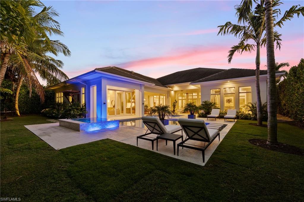 This like new coastal contemporary residence, designed by Falcon Design and built by Knauf-Koenig Group, offers luxury in the Moorings. Thoughtfully crafted with refined finishes and an open, elegant floor plan, this 5-bedroom plus 5½-bath, beautifully furnished home spans over 4,600 square feet of living space on one level, seamlessly blending sophistication, comfort, and effortless indoor-outdoor living.

A grand entry welcomes you into light-filled interiors highlighted by soaring ceilings, custom millwork, Lutron automated shades, multi zone surround sound, and expansive glass doors that invite abundant natural light. The gourmet kitchen serves as the heart of the home, featuring premium cabinetry,  Cristallo countertops, Wolf and Sub Zero appliances, and a generous island that flows effortlessly into the great room and dining areas—ideal for both everyday living and entertaining. 

The luxurious primary suite offers a serene retreat with a spa-like bath, while additional guest suites provide privacy and comfort for family and visitors. The outdoor living space feels like a private tropical oasis showcasing a beautiful pool and spa, covered lanai, summer kitchen, private outdoor shower, hammock area, and lush landscaping designed for both relaxation and gatherings. The home has been meticulously maintained and includes new HVAC systems and an X Flood zone location for peace of mind.

Ideally located just minutes from white-sand beaches, premier shopping and dining, and all that Naples’ coastal lifestyle has to offer, this exceptional Moorings residence is truly move-in ready and offers an outstanding opportunity to enjoy luxury Naples living.