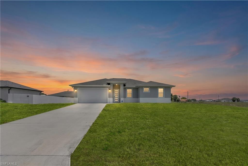 Welcome to this beautiful 2021-built home located in the Glades County section of Port LaBelle! Situated on an oversized 0.30-acre lot, this property offers plenty of room for children to play, outdoor entertaining, or even the future addition of a pool. Designed with both style and functionality in mind, the home features hurricane impact windows and doors, soaring high ceilings, and upgraded taller interior and exterior doors that create an open, spacious feel. The expansive three-panel sliding glass door opens almost entirely, seamlessly blending indoor and outdoor living—perfect for enjoying Florida's beautiful weather. Inside, you'll find durable tile flooring throughout, making maintenance a breeze while providing a clean, modern look. Best of all, this home is offered at a price below the appraised value of a comparable property. Whether you're a first-time homebuyer, looking to upsize for a growing family, or simply searching for a newer move-in-ready home with extra outdoor space, this property checks all the boxes. Don't miss your chance to make it yours!