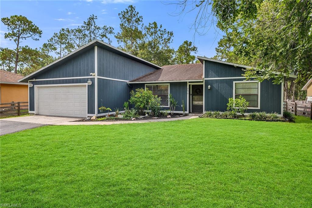 Set on a spacious 1.14-acre lot with no HOA, this property offers the freedom and flexibility to create the lifestyle you've been looking for. Whether you envision adding a pool, workshop, garden, or simply enjoying the privacy and open space, the expansive homesite provides endless possibilities while still being conveniently located near all that Naples has to offer. Inside, this well-maintained residence features a thoughtfully designed floor plan with three bedrooms, two bathrooms, and a two-car attached garage. Laminate and tile flooring flow throughout the home, while vaulted ceilings create an open, airy atmosphere filled with natural light. The living and dining areas are seamlessly connected, making everyday living and entertaining effortless. Glass sliding doors open to the backyard, creating an easy transition between indoor and outdoor living. The recently updated kitchen is both stylish and functional, featuring stainless steel appliances including a dishwasher, microwave, range, and refrigerator with freezer and icemaker. Ample cabinetry and workspace make meal preparation a pleasure while remaining connected to the main living areas. The primary suite is a relaxing retreat with abundant natural light, a ceiling fan, and dual closets that provide generous storage. The en-suite bathroom is equipped with dual sinks and a walk-in shower for added comfort and convenience. Two additional guest bedrooms offer comfortable accommodations, with one featuring a ceiling fan and both providing ample closet space. Outside, the fenced and gated front yard provides added privacy and security, while the patio overlooks the fully fenced backyard with an abundance of green space for outdoor enjoyment. Whether hosting gatherings, creating a play area, accommodating pets, or designing your own private oasis, this oversized property is ready to accommodate your vision. Combining generous acreage, modern updates, and the rare benefit of no HOA restrictions, this property presents an exceptional opportunity to enjoy the best of Naples living.