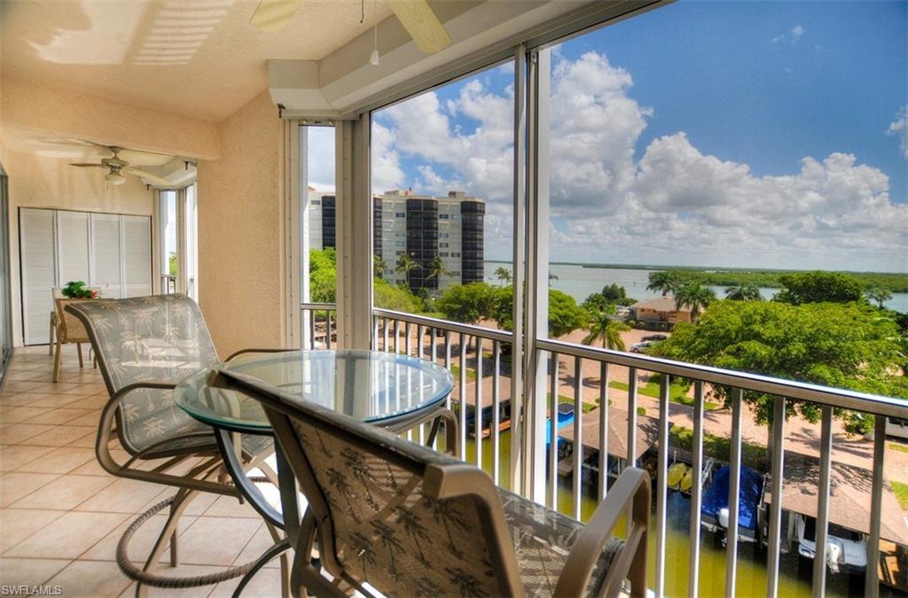 Enjoy canal and Estero Bay views from this furnished 2 bedroom, 2 bath Casa Marina condo that INCLUDES an under building parking space!  The spacious screened balcony faces east, so you can enjoy morning coffee watching the beautiful sun rise skies.  It's also a great place for lunches and quiet candlelit dinners.  With boat docks on only the far side of the canal (versus both sides), dolphin and manatee are frequent visitors.  The lanai, as well as the guest bedroom and kitchen windows, has electric shutters.  The unit is stylishly furnished and most furnishings are included with the sale.  This is a split floor plan, with the owner's suite having direct lanai access, private bath and walk-in closet.  The living areas are tiled and the bedrooms are carpeted.  Casa Marina is located at the quiet south end of Fort Myers Beach with amenities that include a large community pool, tennis courts and fishing pier. The community is also within easy walking distance to deeded beach access, shopping, restaurants and Fish Tale marina. Deep water Gulf access boat docks are available for lease or purchase at Casa Marina. Great rental unit, weekly rentals allowed.