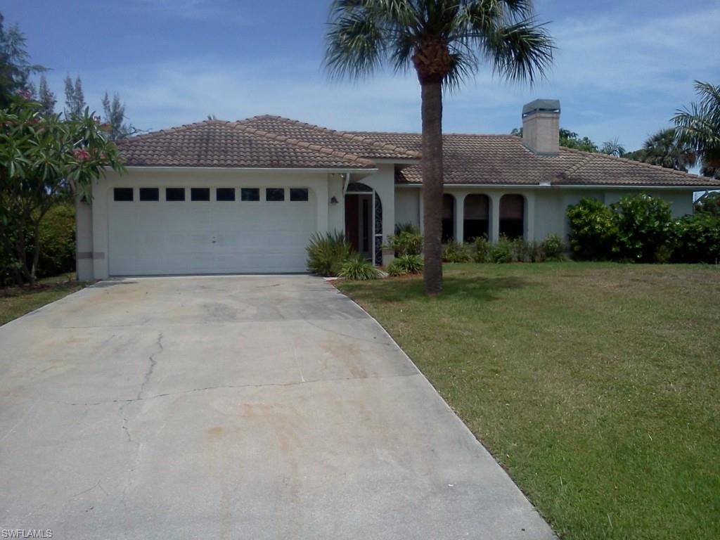This home feels good! A serene setting overlooking a lake and the golf course gives the owner a chance to enjoy the natural environment that Pine Island property has to offer. A nicely kept home in the wonderful Alden Pines golf course community has everything for your active Florida lifestyle. Just minutes from the waters edge, you can be out fishing, boating, walking, bird watching, or dining at the nearby Tarpon Lodge. Oh, and don't forget the golf! The ample screen enclosed outdoor living area is accessibly from both ends of the home. A bathroom is accessible to the outdoor seating area. There is a small dock at the lakeside. The interior has a great room configuration, with a fireplace and split floor plan offers privacy when necessary and togetherness when desired. The master bedroom lives large with a superb sunrise view over the water, a large dressing and vanity area, and walk in closet. The kitchen is tastefully upgraded with gorgeous granite counters and recent appliances. Come inside...you won't be disappointed!