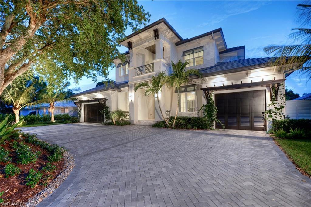 This custom built estate by DIVCO is situated with impressive water views that are among the longest in this section of Park Shore, and is built with sleek elements that make this a sought-after gem in the Naples area. Rooms are spacious, and include 4 bedrooms plus a den, 5 full bathrooms, all spread over 4,602 square feet under air and 6,622 square feet total. Upgrades and other room notables are only fitting for an estate home of this magnitude, and include a dramatic double-door entry complete with a raised foyer, a modern staircase, detailed crown moldings, and additional decorative features, wood coffered and tray ceilings for added appeal, gourmet kitchen with fine modern appliances and custom cabinetry, custom tile and wood flooring, pocket sliding doors that help bring the outdoor beauty in, a residential elevator leading to an upstairs family room with wet bar, 3-car garage, home generator and much more. The lanai is a true retreat, with a spectacular pool and spa with a sun shelf and water features, a outdoor kitchen and cooktop, wet bar, and fireplace. This home is within walking distance to Venetian Village and Park Shore offers a private beach association.