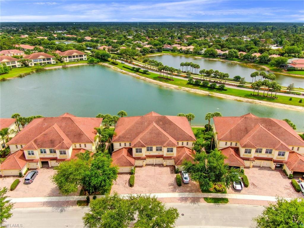 Location, Location, Location arguable the best view at Hawthorne!  This carriage home is a spacious open floor plan home with almost 2300 square feet and 10 foot ceilings with trays.  The rear lanai is truly a gem with an oversize footprint, overlooking a long lake view.   The Hawthorn community boasts of amenities to include 24 hr gated community with a guard, tennis courts, two swimming pools, spas, a fitness room and a community room all in the heart of Bonita Springs near beaches and the RSW airport. If It could not get any better this home comes with a 2 car attached garage.
