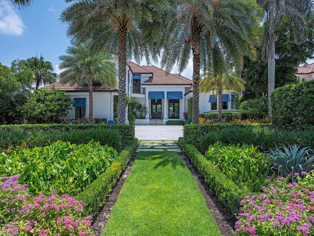 Enjoy the Port Royal Lifestyle with the beach across the street! Located on prestigious South Gordon Drive, this beautiful four-bedroom-plus-den home offers deepwater dockage, easy Gulf access by boat, and access to the private Cutlass Cove beach club across the street. Eligibility for Port Royal Club membership. Renovated in 2017 this home has a first floor primary suite, great room and open kitchen and family room. Walls of windows in the main living area offer, unobstructed water views. Home features spacious patios for outdoor living, sunning and outdoor dining.  The comfortable, shaded lanai is complemented by a large pool and spa and an outdoor grill. The home has high ceilings, large windows,  pool bath and three-car garage. With its idyllic location and the finest beach, boating and club opportunities available, this is the perfect Port Royal residence to call your home. Offered furnished.