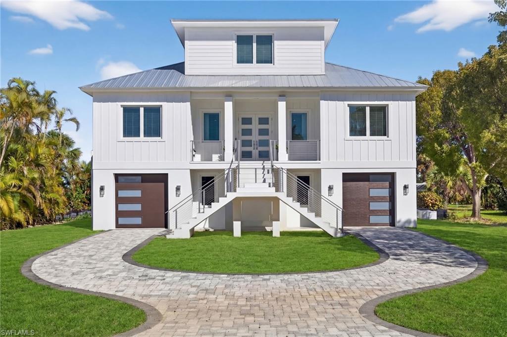 BRAND NEW CONSTRUCTION! This gorgeous new home was beautifully designed to capture the spectacular long views down the fairway. With eastern exposure, it also offers amazing sunrise views. Built using Insulated Concrete Form technology, this home has exemplary wind resistance, energy efficiency, fire resistance, and is wonderfully quiet. With all impact windows and doors and a metal roof and built to current codes, this is a home that is built to withstand and excel in Sanibel's coastal environment. Beautiful wood floors, high ceilings, solid core interior doors, plentiful windows, stunning custom bathrooms, a fabulous chef's kitchen, and a huge outdoor living space make this home elegant, comfortable, and inviting. Two en suite guest rooms and a top floor primary suite provide privacy and relaxing accommodations for all. Interior and exterior stairs connect the elevated living space with the pool area that includes a heated pool and spa and an outdoor kitchen incorporated in the screened area. The beach path is just down the street, offering quick access to the deeded beach access. The community is also perfectly located near many shops and restaurants along Sanibel's main street. With an ideal location, exemplary construction, splendid decor and perfectly chosen furnishings, 1272 Par View is ready to be your incredible new island home!