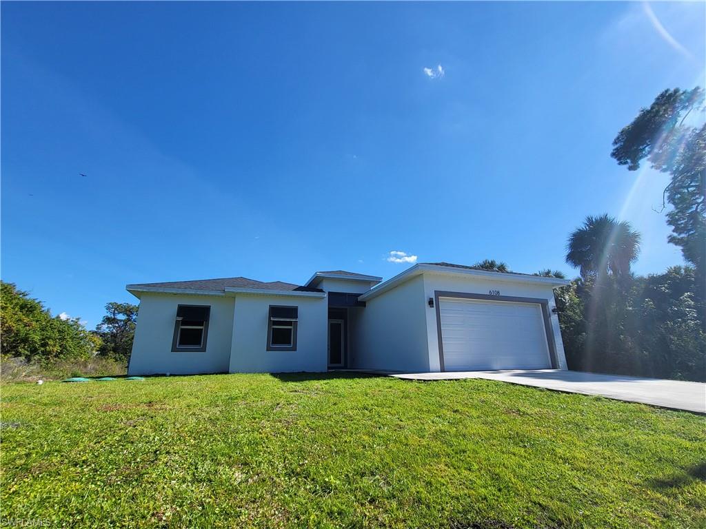 *** WATERFRONT HOME ON CANAL ***  EXTRA WIDE VIEW IN BACKYARD COMPARED TO MOST HOMES IN THE NEIGHBORHOOD !! Comes with Buyer Warranty  **Stunning Modern Home with tens of thousands in upgrades**! Welcome to luxury living in this
 meticulously designed modern home nestled in the heart of Buckingham Fort Myers. Step into elegance with pristine white polished floors that
 exude sophistication and charm throughout the home. - **Designer Kitchen Elements:** The gourmet kitchen features beautiful quartz
 countertops, designer cabinetry, and top-of-the-line appliances, creating a perfect blend of style and functionality. - **Huge covered Patio with
 Lights:** Entertain guests or unwind in style on the spacious covered patio, illuminated by enchanting lights, offering a seamless indoor
outdoor living experience. - **Luxurious Master en-suite:** Retreat to the opulent master bedroom featuring a luxurious en-suite bathroom
 complete with a gorgeous freestanding tub, huge shower, and premium fixtures, providing a sanctuary of relaxation. - Enhancing both
 aesthetics and functionality, decorative shutters, impact windows and doors add a touch of elegance while providing security and peace of mind.- **Prime Location:** Enjoy the convenience of an amazing location offering easy access to amenities, shopping, dining, and entertainment
 options. - **Finest Materials Used:** Every detail of this home reflects quality craftsmanship and attention to detail, with the finest materials
 used throughout to ensure lasting beauty and durability. This exceptional residence offers the epitome of luxury living, combining modern
 elegance with comfort and convenience. Don't miss the opportunity to make this dream home yours. This home has characteristics of a million
 dollar home with an amazing price! Some photos of the furniture in this listing have been virtually
 rendered.