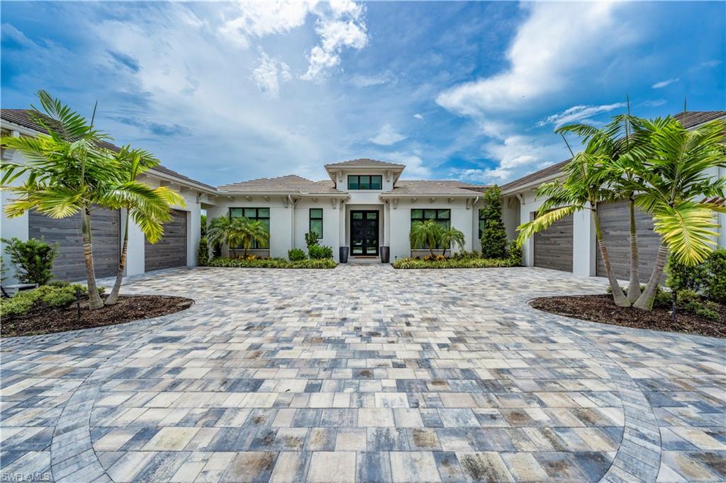 TRANSFERABLE GOLF MEMBERSHIP AVAILABLE. Built by Diamond Custom Homes with stunning Western exposure over the Golf course, this remarkable home features over 4700 sq feet under air. Step through the double glass door entry into the foyer and immediately you will be immersed in a Zen luxurious interior. Soaring, beamed ceilings offer an understated opulence, and the gleaming floors anchor the great room with built in feature wall including a fireplace.  The masterfully curated kitchen has Thermador appliances featuring a gas stove w 6 burners, and griddle, wall ovens, specialty coffee maker and a three-panel refrigerator/freezer/wine refrigerator! The butler's pantry offers an additional refrigerator and loads of storage. Ideal open dining overlooks the lanai and the sparkling pool/spa beyond to Lakes course hole 11.  Immerse yourself in relaxation in the spacious primary suite with seating space and generous walk-in closets. The primary bath is a beautifully private oasis with separate soaking tub, dual shower including a rainhead and multiple shower heads and handheld sprays. 3 additional guest suites all with motorized privacy shades for maximum comfort offered to your family and guests. 4 garages with a car lift and electric car charger and air conditioned with new mini splits and built in storage. Continue your fabulous lifestyle to your outdoor space, covered to protect from the elements, are the outdoor kitchen and seating area and overlooking the gorgeous "fire and water" saltwater pool/spa.  There's a gas firepit perfectly situated for stargazing. The impact resistant windows and doors, lanai shutters and screens and a whole house generator offer peace of mind for those inclement times!
Quail West Golf & Country Club is a designated Platinum Club of America making it one of the top 10 Country Clubs in the USA. Amenity rich and 2 golf courses, full-service spa, tennis and pickleball and a state-of-the-art fitness center, Bocce, playground for the children and a spectacular clubhouse.  Dining options, casual and more refined, open bar and many social activities offered to facilitate your beautiful SWFL lifestyle.  Easy access to sandy gulf beaches, downtown Naples and RSW and Naples airports.