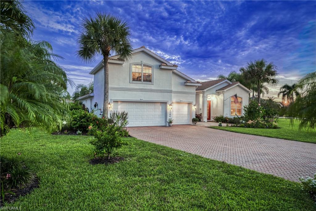 Proudly sitting atop one of the largest lots in Valencia Lakes, this Estate like property delivers stunning long water views against a Southern Sky. The generous floor plan offers 4 bedrooms and 3 bathrooms all on the first level, an extended 3 car garage, and a bonus room that could be a perfect office, secluded den or 5th bedroom. A newly upgraded pool and spa shimmer at night with LED accent lights and provides the perfect setting to enjoy this backyard oasis. Owners will have the pleasure of retreating to a sprawling Primary suite with a remastered shower, a newly installed closet system, and a cozy sitting nook. This home’s long list of upgrades include: a 3-year-old roof and gutters, recently sealed oversized driveway, brand new pool heater, newly sealed garage floor, new garage door opener, brand new carpet, new shower glass and tiles in each bathroom, fresh paint inside and out and much more. With ultra-low HOA fees, Valencia Lakes offers one of the best community values in all of Naples!