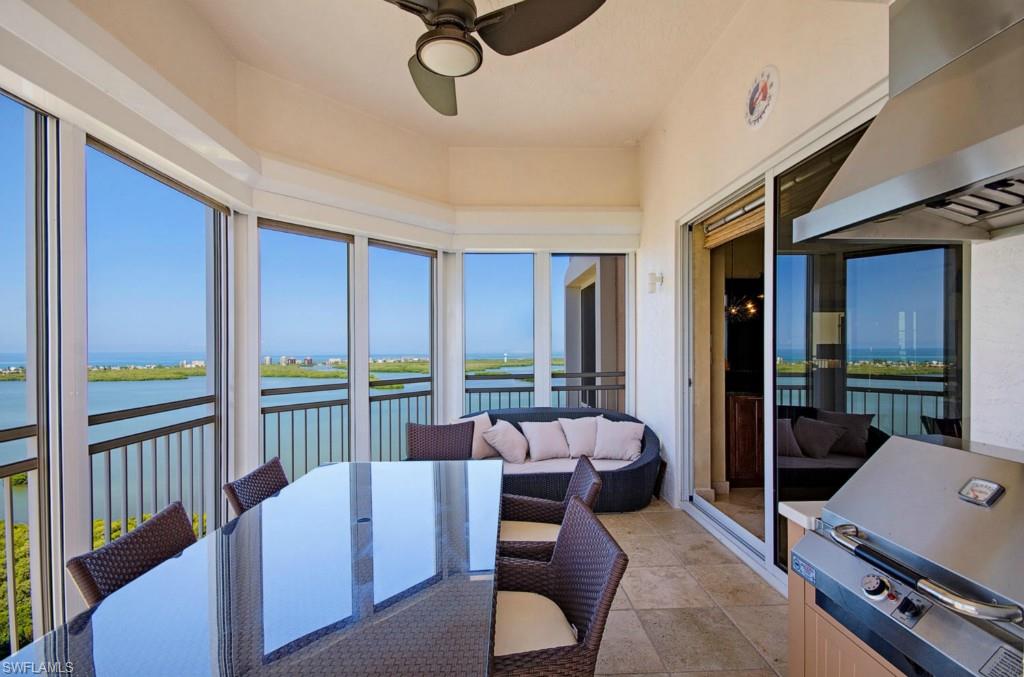 C.10327 - Exceptional, exquisite and elegant!  Panoramic views of Gulf of Mexico, Estero Bay, marsh with wildlife and the Bay Island golf course situated in Bonita Bay.  Ride your private elevator up to this 25th floor end unit filled with designer hi-end furnishings, selected to appeal to buyers looking for a sophisticated and modern setting.  Unique lighting fixtures, rich wooden shutters, custom closets, marble flooring in living area, bamboo flooring in bedrooms, 11 ft. ceilings and special wall treatments add grandeur to this beautiful and exciting residence!  Carefully chosen art work and accessories add the final touches to this spectacular 3 bedroom /3 bath home.  Entertaining is easy with a built-in grill on one of the 2 spacious lanais, with Hurricane shutters for convenience.  Sold turnkey, this home is waiting for you to enjoy!  Amenities include a resort pool & spa, club room, fitness & spa center, theatre & billiards.  Bonita Bay has 5 golf courses, walking & biking trails, marina, country club, fitness & tennis centers, 3 parks and a private pavilion on the Gulf of Mexico.