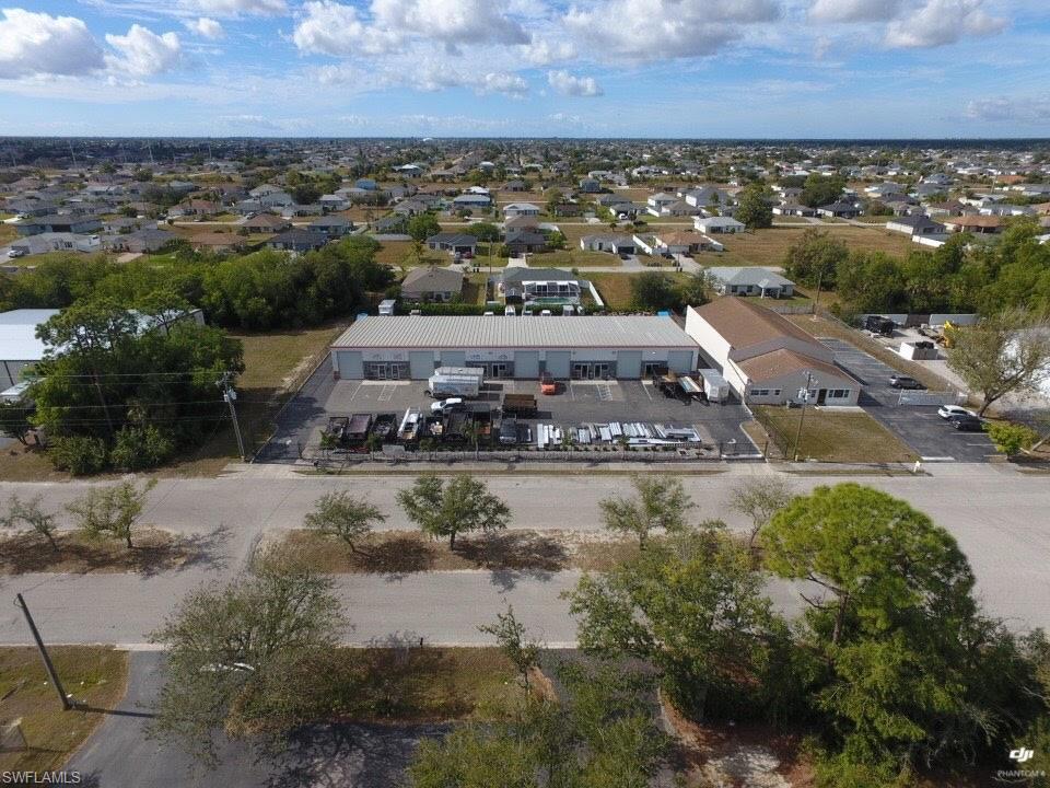 Built in 2004, and originally designed as a 7 unit multi tenant office warehouse complex this property has gone through an extensive interior building remodel along with exterior upgrades. Within the last 2 1/2 years, improvements include new offices, conference room, kitchen, paint, epoxy floors, roll up doors, interior walls removed between units 1 and 2 (3,000 sf) insulated and under air, 2 hour rated fire door, removal of walls in units 6 and 7 (open warehouse), new HVAC systems on wall brackets, parking lots and driveway have new blacktop in the back with surface coating both front, back and sides of the building, new fence with rolling manual gates, vivant security sysytem, landscaping and sprinklers. Seller could offer a sale lease back leasing back 6,000 sf (4 units) or could vacate altogether. This is rare opportunity to purchase a very clean and well maintained free standing Industrial Warehouse building on a 40,000 sf fully fenced lot in Cape Coral. There are numerous possibilities and options for this fine property whether your an investor or end user.