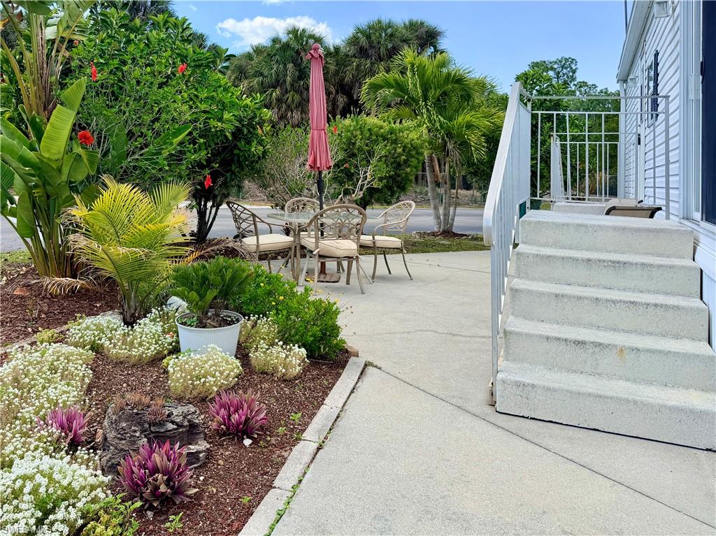 Welcome to the perfect Naples getaway! This charming 2005 park model in the highly desirable Enchanting Shores community offers relaxed Florida living with an updated, open floor plan. Enjoy peace of mind with a May 2026 2.5 Ton AC, 2018 metal roof, vaulted ceilings, and a well-designed layout that maximizes comfort and functionality.

This furnished, move-in-ready home features a welcoming interior and an inviting outdoor patio, ideal for morning coffee, evening breezes, or gatherings with friends. The community provides exceptional value with a private boat ramp, indirect Gulf access, and boat storage [check availability]—a rare combination at this price point.

Enchanting Shores is a vibrant 55+ community known for its outstanding amenities, including a pool, clubhouse, pickleball, tennis, shuffleboard, bocce, billiards, ping pong, community events, and organized activities. Its unbeatable location places you conveniently between the world-class beaches, dining, and shopping of Naples and Marco Island.

Whether you're seeking a seasonal retreat or a full-time residence, this well-maintained property delivers exceptional value and the quintessential Southwest Florida lifestyle.