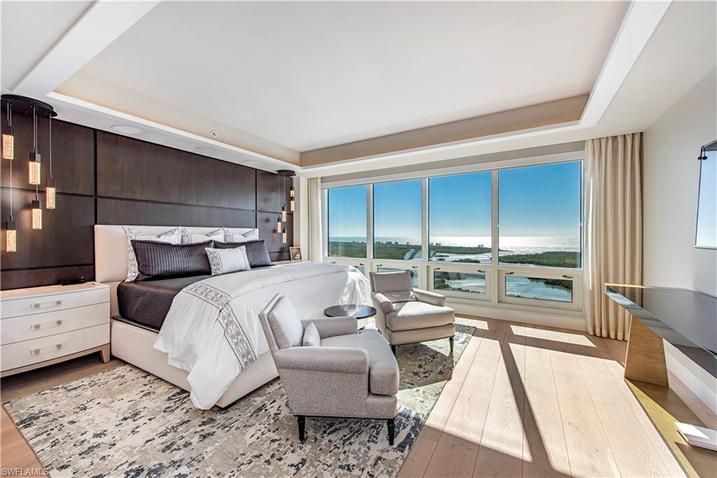 Rarely available PENTHOUSE! Living within a five-star resort, Kalea Bay debuts a new level of elegance with this incredible unit. Private elevator foyer, wood floors, custom ceilings & built-ins throughout showcase the open floorplan. Floor-to-ceiling walls of glass in great room provide dramatic water views and create an expansive living space of extraordinary scale & light. A chef’s dream kitchen equipped with high-end accouterments including natural gas cooktop, Wolf & Subzero appliances and butler's pantry. A luxuriant master suite includes a large walk-in closet with custom cabinets and full wall of windows. Master bath includes soaking tub, custom marble floor inlay, standing vanity with backlit countertop, two expansive vanities & large shower. Two spacious en-suites plus a den/4th bdrm include a custom built-in desk. A beautiful outdoor setting completes the open lanai area. PH units boast coveted deeded (nearly 3-car) garage that could easily fit 2 cars, golf cart & extra storage! Float 200' above the ground while swimming in the rooftop pool & sky deck. Kalea Bay's spectacular amenities include a full-service club, 2 restaurants, 3 pools, tennis/pickleball & guest suites.