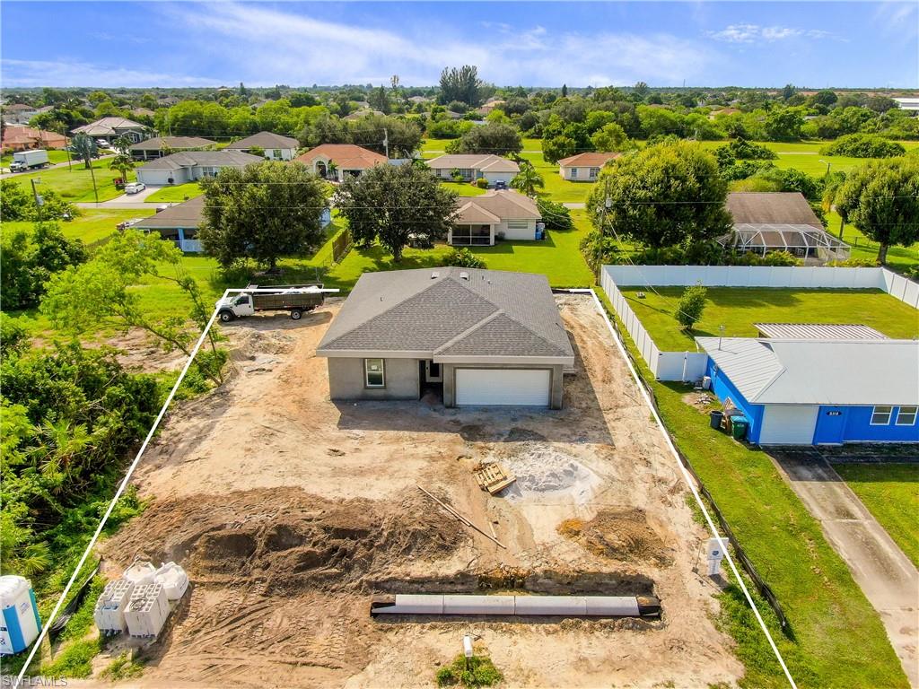 Prime Location!!! Welcome to NE of Cape Coral, one of the fastest growing areas in the beautiful city of Cape Coral !! This wonderful modern open floor plan concept brand new  Single Family Home sits  on a 0.23  acres of land,  features nearly  1,500 Sq. Ft of living space, 3  bedroom,  2 Full  new bathrooms with quartz, 2 car garage. Freshly painted inside and out, new kitchen with soft-close cabinets, quartz, new stainless steel appliances, new doors, new based boards,  new  AC system, new light fixtures, new plumbing, new smoke detectors, alarm system new water heater, new well equipment. Home is equipped with Taex built-in pest control system, irrigation system,  hurricane impact doors and windows, laundry room with utility sink,  Spacious master bedroom, new master bath, double-sink, 1 huge walk-in closet,  new  tile throughout the home. The location is close to many of Cape Coral top schools, close to US 41, North Fort Myers, hospitals,  shopping, dining, entertainment & just 20 mins to SW Florida International Airport, NO HOA Fees. This home will not last! Home will be complete by the end of October 2020