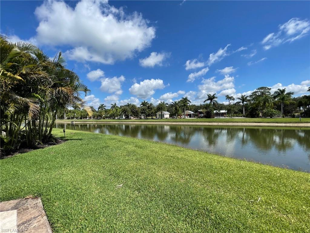 There’s something special about arriving at Lot 108 inside RiverBend Motorcoach Resort. Maybe it’s the way the water greets you first, calm, glistening, and peaceful on this beautiful north-facing waterfront lot. Or maybe it’s the unmistakable balance it offers, tucked away enough to feel secluded and serene, yet positioned in one of the most sought-after spots in the resort. Step outside your coach and you’re just across from the pool, where laughter echoes, friends gather under umbrellas, and afternoons drift by in the sunshine. Bocce courts? Just steps away. If you love being close to the fun without giving up your own peaceful retreat, this location truly delivers the best of both worlds. Lot 108 is designed for living outdoors. It’s secluded, peaceful, and perfect for entertaining, whether you're hosting friends on the front patio or unwinding on the back lanai as the water reflects the changing sky. Gorgeous tile flows throughout the lot, lined with pavers that frame the landscaping beautifully, giving the entire space a polished and inviting feel. Inside the coach house, you’ll find thoughtful upgrades including an updated kitchenette, a walk-in shower, and dual French doors with privacy blinds that let in beautiful natural light while maintaining comfort and privacy. When you're ready to socialize, head to the River Clubhouse for poolside afternoons at the cabana bar, refreshing dips in the resort-style pool, relaxing in the hot tubs, and evenings filled with live music, themed dinners, trivia nights, bocce, Zumba, line dancing, Texas Hold-Em, and so much more. The lifestyle here is active, welcoming, and full of energy. And just beyond it all flows the peaceful Caloosahatchee River, perfect for scenic walks beneath moss-draped oaks, boat watching, and sunset strolls that remind you why Florida living is truly something special. Lot 108 isn’t just a property.
It’s sunshine. Palm trees swaying. Friendly waves from passing golf carts. Painted skies and tropical breezes.
It’s that unmistakable Florida lifestyle — wrapped into one irresistible waterfront opportunity. Not all Items on property or in pictures convey, please ask agent.