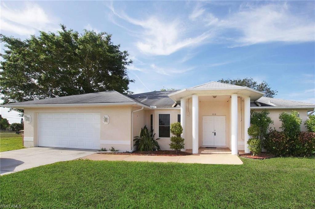 Excellently remodeled freshwater canal home. New cabinets with custom made counter tops in the kitchen with New appliances. New impact and insulated double hung windows. Lots of tile work in the bathrooms and on the walls. No updating or remodeling work to be done here. Move in and sit down. A spacious 16'x10' storage shed will free up your 2 car garage for just that...2 cars. Huge screened lanai. Underground sprinklers. Plenty of room for a pool. The back yard has been landscaped and leveled so you can sit around an outdoor fire and enjoy drinks and conversation. . This 85' wide lots sits on a canal loaded with bass and other fish. Concrete dock is a great place to sit and enjoy those gorgeous Florida sunsets! Home has security cameras that can be monitored form your phone.  Don't miss out on this amazing home!!!