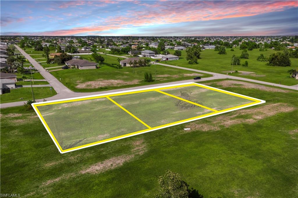 Rare Opportunity – 3 Adjacent Lots in NW Cape Coral! Seize this incredible chance to own three contiguous parcels being sold together, offering a combined total of 0.70 acres of prime land in the highly desirable Northwest Cape Coral/ Diplomat area. Situated just off Diplomat Parkway, these lots are perfectly positioned in one of the city’s fastest-growing regions — surrounded by beautiful new homes, future development, and promising infrastructure expansion. Whether you're an investor, developer, or future homeowner, this is an ideal opportunity to secure a large, versatile piece of property in a rapidly appreciating market. This location offers quick access to major roadways, schools, golf courses, parks, and shopping. This is zoned residential but is also part of the Future Commercial Corridor with endless possibilities. There are no HOA fees or deed restrictions, giving you freedom and flexibility in your plans. Don’t miss out on this unique opportunity to invest in one of Cape Coral’s most promising and peaceful areas. Large, connected parcels like this are hard to find — act now to secure your place in this rapidly growing part of Southwest Florida.