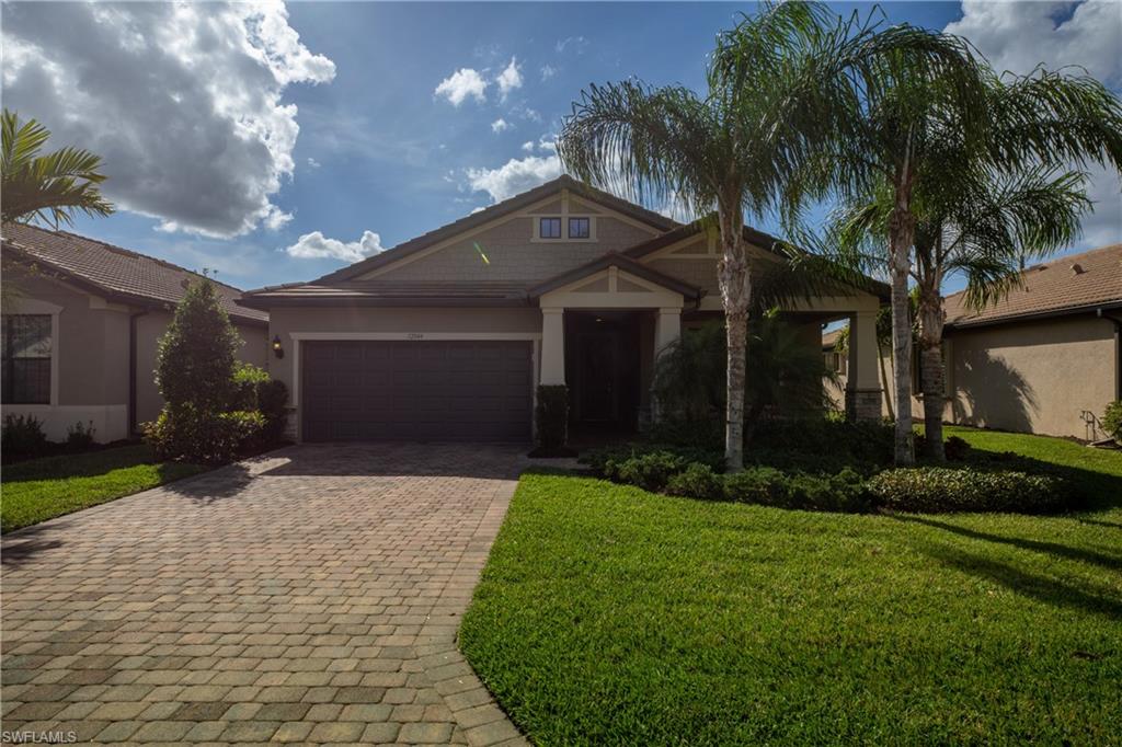 This home is the one you have been waiting for! The "Summerwood" floorplan by Pulte is ideally located in the cozy community of Camden Square. This gated community consists of less than 100 homes and has no CDD fees or city taxes. With over $50,000 in upgrades, and the option to purchase the home fully furnished (minus the puppy), all you need is your toothbrush! From the plantation shutters,  crown molding throughout, wainscoting at the foyer, extended garage, extended kitchen island, and extended lanai, there is no detail not attended to! Save more money on your energy bill with natural gas powering the cooktop, oven, water heater, and dryer. Even though the home is spectacular inside, the outside lanai overlooks a large backyard and has a spectacular view of the lake. Schedule your showing as soon as possible!