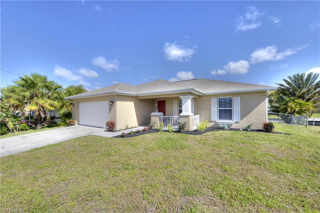 Welcome to this wonderful 3 bedroom +den, 2 bath freshwater canal home within the Cape Coral "Chain of Lakes." Launch your Kayak, paddle board, jet ski or boat & enjoy miles of canals connected to a large freshwater lake system. As you walk up to the entryway you will notice cedar board on the ceiling outside & also on the back lanai.  This house features many upgrades, including a gorgeous white farm sink & touch faucet in the kitchen. AC 2020, exterior paint & interior paint new in 2017. Master shower has frame-less door, kitchen appliances are 2017,except dishwasher. hot water heater 2016. Nice granite counter tops in both bathrooms, tiled master shower & 2 large walk in closets! The house has 5 1/2 inch baseboards throughout & newer window screens on all the windows! This house has a very spacious feel, check it out for yourself!  ALL ASSESSMENTS PAID! NO FLOOD INSURANCE REQUIRED HERE. Come see this beautiful house for yourself...