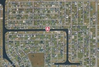 Discover an exceptional waterfront homesite offering the perfect canvas to create a distinguished custom residence in one of Cape Coral's most desirable areas. Set along a scenic canal ideal for boating, fishing, kayaking, and other waterfront activities, this premium property combines tranquility with convenience. Its strategic location provides effortless access to Punta Gorda Airport, upscale dining, shopping destinations, parks, and a wide range of recreational amenities. Surrounded by impressive residences valued at over half a million dollars, this is a rare opportunity to invest in an established luxury neighborhood and design a home that embraces the elegance, comfort, and exceptional waterfront lifestyle that make Cape Coral one of Southwest Florida's most sought-after destinations.