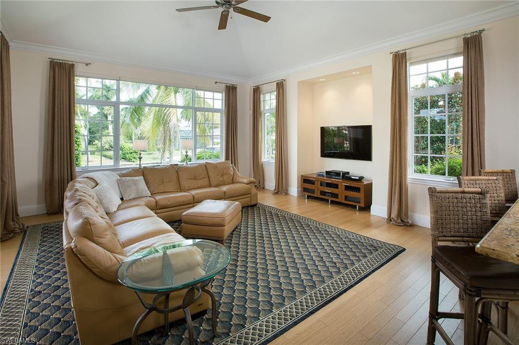 Within walking distance to the white sand beaches of the Gulf of Mexico, this waterfront, single family home provides the homeowners with endless boating and beaching possibilities. Offering multiple living spaces with hardwood flooring, the home is ideal for entertaining or a busy family’s lifestyle. The kitchen opens to the family room and pool beyond with water views. Three bedrooms on the first floor and a fourth and loft on the second floor offer privacy for homeowners and guests. A full outdoor kitchen, pool, spa and dock provide everything needed to enjoy the Naples lifestyle. The kitchen features granite countertops, glass-fronted cabinets and a six-burner gas range. A spa-like master bath and generous master suite is a perfect retreat. Conveniently located to nearby Third Street South and Downtown Naples for shopping and gourmet dining.