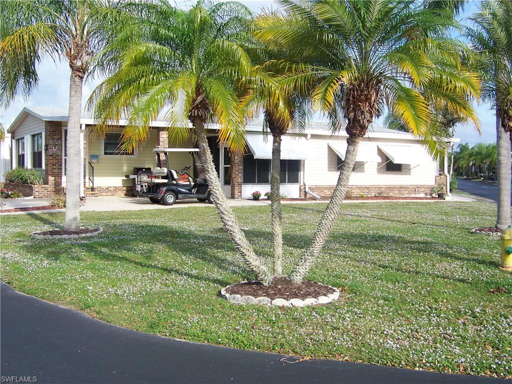 Very LARGE, well maint. home offered furnished/turn-key with land share included located on corner lot w/"green space"! Welcome to one of the "FRIENDLIEST" GATED COMMUNITIES around that welcomes you & your furry pets & offers an array of FUN amenities to! Extremely spacious w/1848 sq ft under A/C which includes large lanai! Extras include:Open floor plan, lg. Florida room w/wet bar & mini fridge, LOTS of closet space(large walk-ins/both master/guest), updated dual vanities in master bath w/recessed lighting. Kitchen has double sided break. bar, raised white cabs, nice appliances w/blt.-in micro, tile floors, lots of storage/display shelves & WIFI for life! New/2 years: dishwasher, disposal, kitchen faucet, int. paint, COMPLETE A/C unit(2019),updated breaker box($2000/2020) & replumbed(2020)! Lanai is very comfortable offering all weather acrylic windows, ducted A/C, newer sliding windows in front, lattice & wanescoting, exposed beams, HUGE laundry room w/utility tub, w/d, storage cabs & ext. door(ALL accessible from interior). H. shutters:drop down & accordian, 9 newer tie downs,gutters/downspouts, solid skirting, stamped drive/walkway & MORE! Take a look, you'll be glad you did!