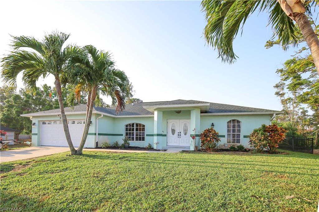 Fantastic location in SWFL, this home is waiting for you. This clean 3 bedroom/2 bath home with den features all tile floors - laid on the diagonal. The beautifully upgraded  "open-concept"  kitchen has stainless appliances and a tiled backsplash.  The great room is contiguous with the open flow of the kitchen allowing for a wonderful family gathering or entertainment area.   This home contains crown moldings,  5 1/4" baseboards and an epoxy garage floor.  Well maintained, the property has had its roof replaced in 2018 , the AC replaced in 2020 and a new water heater in 2020.   The Primary Suite features a large bedroom and bath with a separate soaking tub and shower. There is  a tranquil setting on the large screened lanai and outside patio. The variety of  tropical trees (including fruit bearing) on the back property allows for lots of privacy. There is concrete curbing on the landscape for bedding areas as well. The home is wired for a Security System. Close to all that SWFL has to offer- beaches, shopping, restaurants and airport.   FEMA flood zone X- (no flood insurance needed)  and best yet- NO HOA!