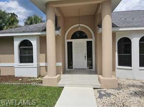 Welcome to this charming 3-bedroom, 2.5-bath home nestled on a spacious half-acre fenced lot at the end of a quiet dead-end-street in the heart of Lehigh Acres. Built in 1994, this well-maintained home offers 1,614 square feet of comfortable living space with a bright, functional floor plan, tile flooring throughout, and generously sized bedrooms.