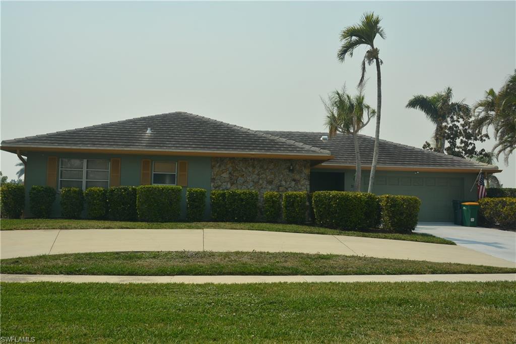 Beautiful sunsets with awesome water views on this well maintained home located on a quite cul- de -sac street with quick access to the Marco River.   Kitchen has granite and stainless appliances, 4 bedrooms and 3 baths all of which are decorated in an island style look.  Enjoy dining and entertaining on the spacious covered lanai overlooking the pool and beautiful wide views of the water.
