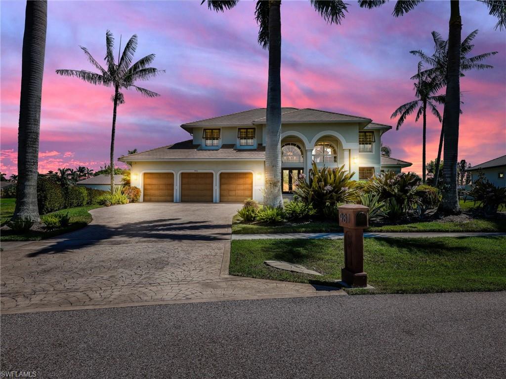 165 feet of waterfront footage! Oversized .54-acre lot, situated in the prestigious ESTATES of Marco Island, this stunning DIRECT GULF ACCESS residence offers timeless elegance, modern upgrades, and a true boater’s lifestyle. It has a private dock featuring two slips and two lifts, making it an ideal haven for boating and fishing enthusiasts. Step inside to a bright, sophisticated interior with soaring ceilings, plantation shutters, custom walk-in closets, porcelain tile flooring, and a timeless brick fireplace feature wall. The open layout flows seamlessly into the chef’s kitchen, complete with a coffee counter, wine cooler, designer cabinetry, and a spacious island designed for entertaining. Upstairs, a versatile loft opens to a wraparound balcony, capturing serene views of the water and the surrounding landscape. Outdoor living is equally impressive, showcasing a newly enhanced lanai with weatherproof cabinetry, panoramic screen enclosure, and a travertine pool deck. At its heart lies a saltwater pool with a peaceful water feature, heated by solar panels for year-round enjoyment. This residence combines luxury with practicality, offering peace of mind through strong construction, designer finishes, and low-cost transferable flood insurance. Experience the rare opportunity to own a home that blends luxury, function, and the very best of island living.