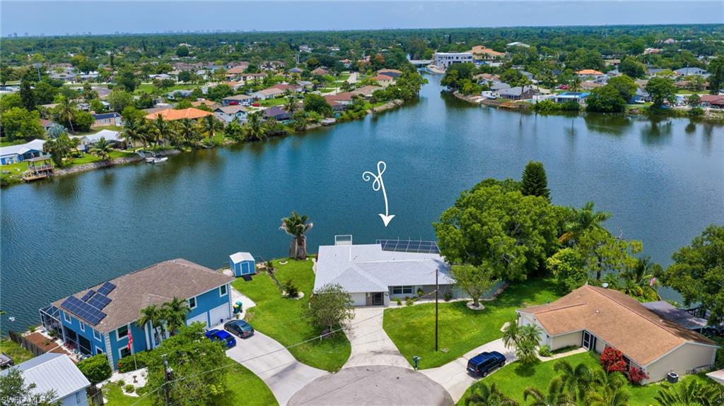 Discover a rare waterfront retreat nestled on the sparkling shores of Lake Sapphire in the heart of Naples. Perfectly positioned on a quiet cul-de-sac, this exceptional residence enjoys an oversized homesite with an impressive 168 feet of lake frontage, offering expansive water views and unmatched privacy. Designed to embrace the Southwest Florida lifestyle, the property showcases an expansive screened pool area surrounded by tropical landscaping, creating a private resort-style setting for relaxing, entertaining, or simply soaking in the peaceful waterfront ambiance. Beyond the pool, a private fishing dock extend into the lake, offering incredible opportunities to fish, unwind, and enjoy nature right from your backyard. The generous fenced side yard provides plenty of space for pets to play freely, weekend gatherings with friends and family, outdoor dining, and backyard barbecues. Whether you're enjoying your morning coffee by the water, spending afternoons poolside, or casting a line at sunrise, every day feels like a vacation. Inside, the thoughtfully designed split-bedroom floor plan offers spacious open-concept living with brand-new tile flooring throughout. Featuring three bedrooms, two full baths, a two-car garage, multiple living spaces, and a dedicated dining area, the home provides flexibility and comfort for both everyday living and entertaining. Large windows throughout capture natural light and showcase the stunning lakefront setting.
Located in the highly sought-after Golden Gate City area, this property offers the freedom of homeownership without restrictive HOA regulations, allowing you to truly make the space your own. Just minutes from world-class dining, shopping, entertainment, parks, and Naples' renowned white-sand beaches, the location perfectly balances tranquility with convenience. Whether you're searching for a peaceful waterfront sanctuary, a place to enjoy Florida's outdoor lifestyle, or a property with room to grow and create lasting memories, this Lake Sapphire gem delivers an extraordinary opportunity. Additional peace of mind comes with a brand-new roof installed in 2024.