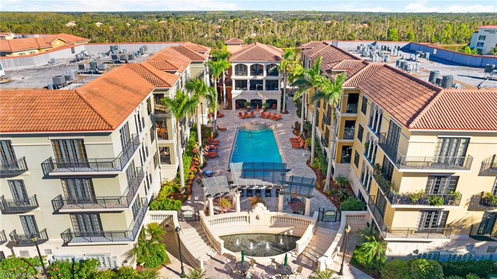 *MAGNIFICENT & BRIGHT ! TOP FLOOR condo in one of the most sought-after buildings in The Residences of Coconut Point! Walk out the door and DIRECTLY into the impressive courtyard of amenities... Community Pool, Spa, Outdoor Grill Area, Clubhouse, & Fitness Center! Renovated tile bathroom, travertine tiled lanai. AC in 2018;  hot water heater 2020. 10' high ceilings and 8' SOLID WOOD doors throughout.  Love the tasteful furnishings? They are negotiable, and make it a breeze for you TO MOVE RIGHT IN ! *BONUS: This Unit comes with a separate large climate-controlled STORAGE UNIT...right on your floor! Additionally, your reserved garage parking space is right below your building. Relish in this maintenance-free lifestyle of upscale residential condominiums adjacent to The Coconut Point Mall. Just steps away from over 20 restaurants and 100 retail stores...Only minutes to Southwest Florida International Airport & stunning Gulf of Mexico sunsets. High Speed Internet, Premium Cable, and Water all INCLUDED in your HOA fees. Never lost power during hurricane!