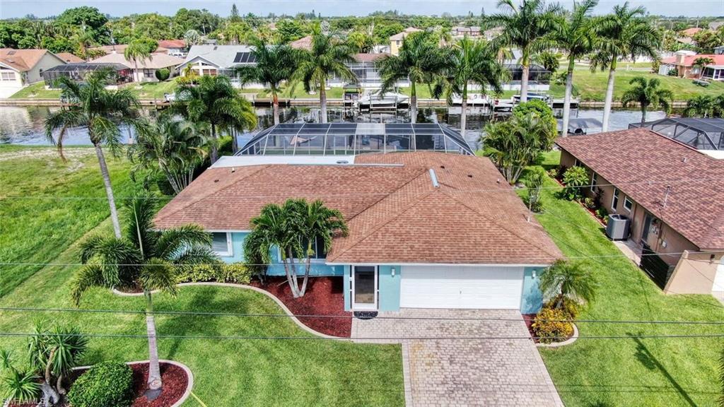 You've been patient, and waiting for the perfect home, and now it is available!  Do you want a fabulous Gulf access home? Did I mention that it has all the modern updates, new appliances, Sauna, hot tub, beautiful salt water pool and large screened lanai?  For the boat lovers, it has a new dock and 10,000lb. lift. Enjoy sitting on your large lanai or dock in the morning with your coffee, or in the evening with your glass of wine. You'll also enjoy the delicious fruits from the Mango, grapefruit and lime tree. The lawn is beautifully manicured and there is even an attractive paved driveway. This a wonderful home for entertaining, is pristine and has been well loved and cared for; there is NO honey do list!!! Call today for your private showing, it won't last long!