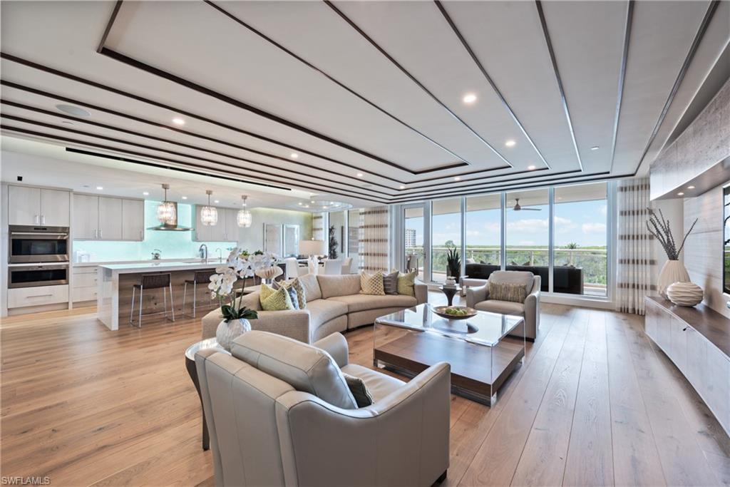 This former Award-Winning Kalea Bay Model showcases a stunning Modern Coastal Chic design, accentuated by exquisite custom finishes and over the top ceiling designs and custom built-ins With 4 bdrms and 4 full bathrooms, this open floor plan unit offers designer lighting, built-in bar, and 2 en-suite guest rooms. The lavish Owner’s Suite comes complete with an incredible walk-in custom closet and spa bath. The gourmet Kitchen showstopper with illuminated backlit sea glass backsplash and boasts a top-of-the-line Wolf/Subzero appliance package, featuring a Wolf induction range and a 48" refrigerator, along with an under-counter wine cooler in the Butlers Pantry. Experience true outdoor living on the expansive 500+ square foot open lanai. Incredible rooftop sunsets with pool, open air fitness and rooftop social areas. The Club at Kalea Bay includes an array of 5 star amenities, including a brand-new 14,000 sqft wellness center, two restaurants, children's area, two outdoor bars, an adult pool, tennis and pickle-ball courts, guest cottages and more. This property is a true gem for those seeking luxury waterfront living. Sold Turnkey with Designer furnishings.