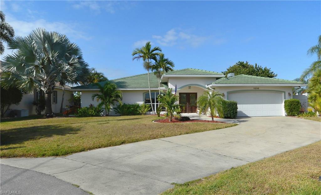 Amazing custom home with a western facing tip lot location in desirable Punta Gorda Isles with 213 ft of seawall, a 30 ft dock and a 10K boat lift all minutes from Charlotte Harbor. Life is sweet with daily gorgeous sunsets views over intersecting canals, all from the spa on the lanai. The floor plan encompasses three spacious bedrooms. Two bedrooms are master suites complete with walk in closets and en-suites ensuring that both you and your guests have privacy. The floor plan includes a formal living and dining room and a 39'x14' family room. Large sliding doors open to a generous lanai bring the perfect Florida weather indoors. The gourmet kitchen features stainless appliances, granite counters, a large island with room for several chef's. Entertain 2 to 20. Enjoy the lifestyle that the residents of Punta Gorda love: Boating, Fishing, Kayaking, Biking the trails, or Walking/Jogging the Punta Gorda Pathways. Live music, Festivals, & Baseball is all a part of the local culture.