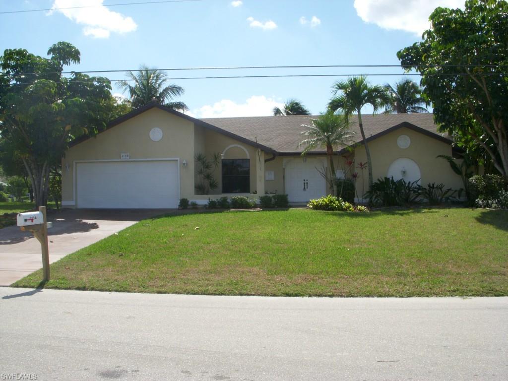 Great SW Cape Coral Neighborhood, Triple Lot, wide Gulf Access Canal, South Exposure, 3 Bedrooms, 2 Bathrooms, open kitchen with Island, Swimming Pool with in ground jacuzzi, new manufactured wood flooring, new master bathroom tile & cabinets, fresh paint inside.