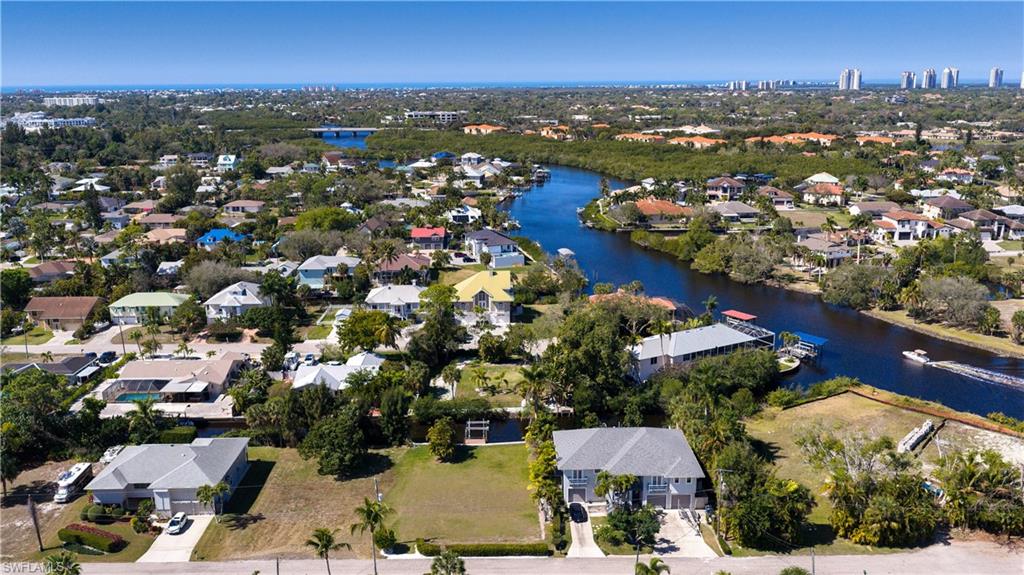 0.22-ACRE GULF-ACCESS LOT with a NEW 2025 PRIVATE BOAT DOCK & BOAT LIFT! Build your dream home and step into the ultimate Southwest Florida waterfront lifestyle—where your days are shaped by sunshine, salt air, and time on the water. From your backyard, CRUISE ALONG THE SCENIC IMPERIAL RIVER—often accompanied by playful manatees and dolphins—on your way to the Intracoastal and the open Gulf. Spend afternoons fishing, island-hopping, or docking at waterfront restaurants for fresh seafood and sunset cocktails. Evenings? Return home for breathtaking WESTERN SUNSETS over a quiet waterway. With 80 x 120 dimensions, desirable west rear exposure, and a peaceful, established street, this homesite offers the perfect setting for a custom residence designed around outdoor living—imagine a pool glowing in the afternoon sun before golden-hour skies take over. 
The property features a RIP RAP SEAWALL a NEWLY REPLACED BULKHEAD, and is cleared, sodded, and ready to build with ELECTRIC, WATER, and SEWER already in place—saving thousands in impact fees. When you’re ready for the sand, you’re just 15 minutes to BBAREFOOT BEACH & BONITA BEACH, where long walks, shelling, and Gulf sunsets become part of your daily routine. Located less than 10 minutes from Coconut Point and just minutes to the energy of DOWNTOWN BONITA SPRINGS—home to Riverside Park events, live music, charming cafes, and beloved local spots—this location blends laid-back coastal living with convenience.