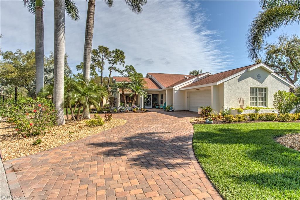 McGregor Woods Estate Size Pool Home Near Sanibel on 1/3 acre lot. Every Upgrade Imaginable. High end finishes.  Located on wide corner lot, beautifully updated 3 Bedroom w/den. 2 full baths, powder room & pool bath.  Circular pavered drive accented with palm trees. New, heated salt water pool with waterfall and changing LED colored lighting w/remote. Large lanai under roof. Private back yard. Home has high end finishes thru out. . Travertine tile floors in living area, Bamboo floors in bedrooms. Cathedral ceilings with wood beams, fireplace. Large open floor plan. 3 sets of new hurricane rated sliders open to pool area. Den with large window. Transom window & skylights make this home light and bright. Huge kitchen opens to great room. Granite counters, breakfast bar, stone back splash, 2 pantries, Stainless appliances. Master Bath looks like a model. Redone in 2017. Soaking tub w/ tub filler, frameless walk in shower, rain shower head, pedestal wood vanities with granite. Master bedroom with sitting area and outdoor patio. Guest bath redone 2017. Lush tropical landscaping. Sprinklers on well. Impact windows, sliders and hurricane rated garage door.
