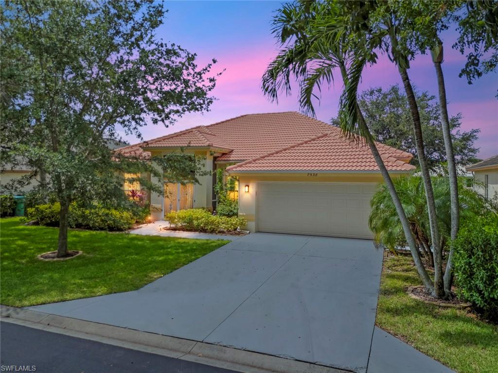 One or more photo(s) has been virtually staged, AI generated or rendered.  Welcome to paradise! Prepare to be captivated by this exceptional 3-bedroom, 2-bath pool home in the highly sought-after gated community of The Orchards in North Naples. Offering 2,197 square feet of thoughtfully designed living space, this beautifully well kept residence features soaring vaulted ceilings, crown molding throughout, PGT WinGuard impact resistant windows and rear sliding glass doors, a hurricane rated garage door, an upgraded island kitchen with a pantry, and breathtaking long lake views that create a tranquil setting.  The open concept floor plan flows seamlessly from the welcoming foyer into the spacious living and dining areas, extending to the screened lanai, perfect for entertaining or everyday living.  Step outside to your private tropical retreat featuring a heated solar pool and spa, outdoor shower, and desirable rear exposure, where you'll enjoy warm afternoon sunshine and spectacular sunset views over the lake.  The expansive 12' x 20' primary suite serves as a peaceful sanctuary, complete with dual vanities, a beautifully updated rain shower, and a generous walk-in closet.  Two additional bedrooms provide comfortable accommodations for family and guests. Additional features include a 
charming breakfast nook, a dedicated workspace, an in-residence laundry room with a utility sink, pull down attic stairs for additional storage, custom built-in cabinetry, and elegant window treatments throughout.  Residents of The Orchards enjoy an impressive array of resort-style amenities, including a clubhouse, fitness center, tennis courts, and pickleball courts. Ideally located just minutes from Naples' white-sand beaches, Tiburón Golf Club, Mercato, Waterside Shops, and the world-class shopping and dining of Downtown Fifth Avenue South, this exceptional home offers the perfect blend of luxury, comfort, and the quintessential Southwest Florida lifestyle.