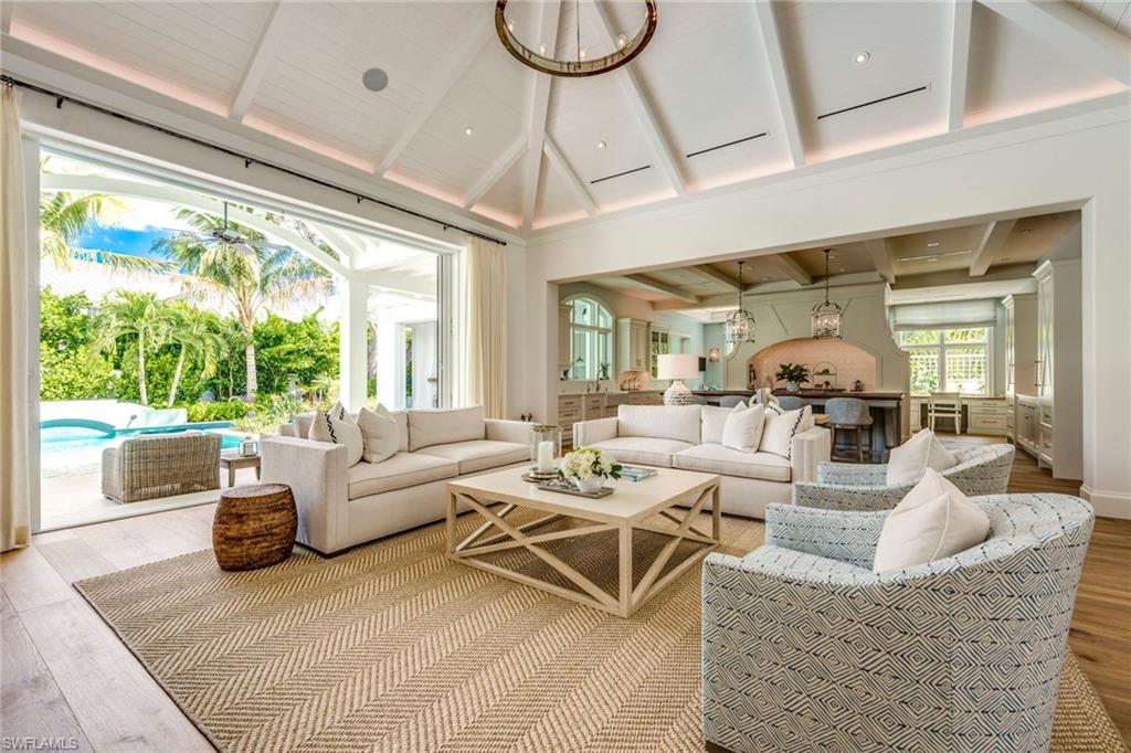 H.13720 - Positioned on a lovely tree lined street in the heart of Naples is a newly, custom, built Herscoe, Hajjar designed tropical retreat. As featured in Florida Design Magazine: this two time 2018 Sand Dollar Award Winner for architecture & interior design encompasses all the unique products and finishes to make it an ideal setting for living the "Naples Lifestyle". The home features exceptional high end finishes and attention to detail that make this home one of a kind. The features include: 4 En-suite bedrooms + Study, ground floor Master, a chef’s kitchen with large island, custom cabinets, white quartz counters, Sub-Zero & Wolf appliances, butler’s pantry, a private elevator leading to the large 2nd level living area with morning Kitchen & additional laundry. The private outdoor area includes a salt water pool/spa with gas & solar heat, a large Summer Kitchen w/ fireplace, roll-down screens, and hurricane shutters. The garage is finished with custom cabinetry to make any handyman envious, propane generator, full smart home Control 4 technology including lights, music,& security. Located blocks away from all the amenities that the beach and Downtown Naples have to offer.