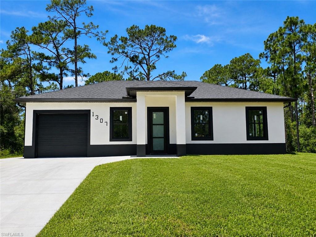 SELLER MOTIVATED! Seller is offering closing cost assistance. This stunning new construction home sits on a spacious half-acre lot and showcases modern luxury throughout. Features include impact-resistant windows and doors, soaring tray and volume ceilings, quartz countertops, Samsung stainless steel appliances, washer and dryer included, custom LED mirrors, floor-to-ceiling tiled showers, walk-in closets, and a desirable split-bedroom floor plan. *The insulated garage door provides added energy efficiency and comfort.* 
Enjoy a spacious great room layout, designer finishes, and plenty of room for a future pool. 
No HOA. 
Don’t miss this exceptional opportunity!