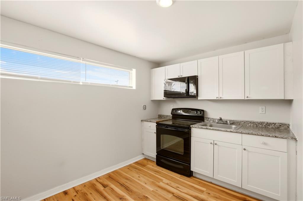 North Fort Myers has 99 Problems but this 1/1 Isn't It! This 1/1 is perfect for you, your dog, and your significant other (on the days they deserve it). Completely remodeled and ready for quiet living, this unit was designed for the person who just wants a clean, comfortable place to call home without the drama. Open floor plan means you get to decide how it lives. Minimalist? Go for it. Every candle you own on display? No judgment here. Wood flooring runs throughout the entire unit, which means you will never have to explain to guests why there is a mysterious smell coming from the carpet. There is no carpet. Problem solved forever. Your kitchen and bathroom have both been fully updated and are ready for the most important routine of your day: shower, coffee, toast, repeat. The mini split keeps things cool all summer long because this is Florida and the heat does not negotiate. Washer and dryer included, because adulting is hard enough already. And when you are ready to leave the nest? Hook's Catch and Smoke'n Pit are both within five minutes when the craving hits. Publix is six minutes away for everything else life requires. It is cozy. It is charming. It is yours. Utilities: Water is included, Electric is $100 per month. Pet Policy: We warmly welcome your furry companions, with the exception of aggressive or dangerous dog breeds.