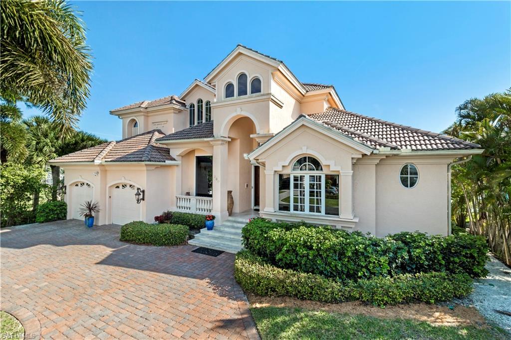 Few homes in Conners have long southern exposure bay views for this price! This move in ready 3+Den 4 full bath is filled with updates. Beautiful Mahogany doors welcome you as you enter the impressive two story living room featuring marble flooring, custom millwork and a two sided gas fireplace. The kitchen has been thoughtfully renovated with custom cabinetry, induction cook-top and double island, perfect for entertaining. The kitchen and family room open seamlessly with 90 degree sliders showcasing the expansive bay views. This home is easy to entertain outdoors with the new picture window screen enclosure and newly extended patio and deck. A main level master suite delivers impressive bay views, while the 2nd level offers two large on-suite bedrooms, a large entertaining bonus room and an open patio perfect for enjoying those world famous sunsets. The walk around boat dock has been recently updated as well with new treks decking and vinyl cover. Lagoon is conveniently located in Vanderbilt Beach within walking distance to beaches, the Ritz Carlton Beach Resort, LaPlaya Beach and Golf Resort and minutes away from Waterside Shops and Mercato with shopping, dining & entertainment.