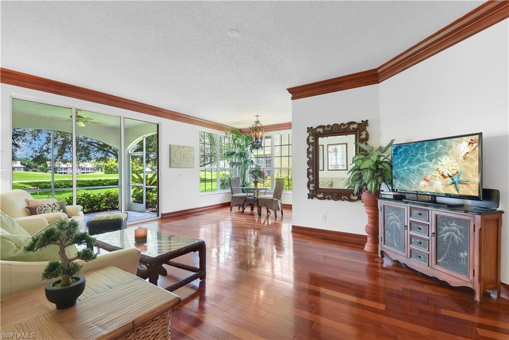 Nestled back in Silver Oaks @ The Vineyards, this first floor condo is surrounded by tall mature oak trees giving the front view of the home an Old Florida feel while the rear of the home has a beautiful golf course view. This home is ideal for seasonal SWFL living and is situated in a gated community w/ optional country club membership. Offering a wonderful open layout w/ luxury features throughout, gorgeous wood flooring, trim throughout, designer cabinets & granite countertops, 5x4 storage room in guest wing, large laundry room, split bedroom floor plan, spacious master suite w/ 8x8 walk-in closet that features high-end shelving, den, breakfast nook, large rear lanai, and a 1-car garage. Recent updates include- new roof 2020, new hot water heater, newer a/c, new screening & door on lanai, and freshly painted interior. Just steps away from the Silver Oaks community center that offers a community room, library, pool, & spa. The Vineyards offers a gated country club setting w/ a DEBT FREE Association. Optional Golf & Social Memberships are available & there are activities for everyone - pools, 2 golf courses, tennis, fitness center, dining, pickleball, bocce ball & more!