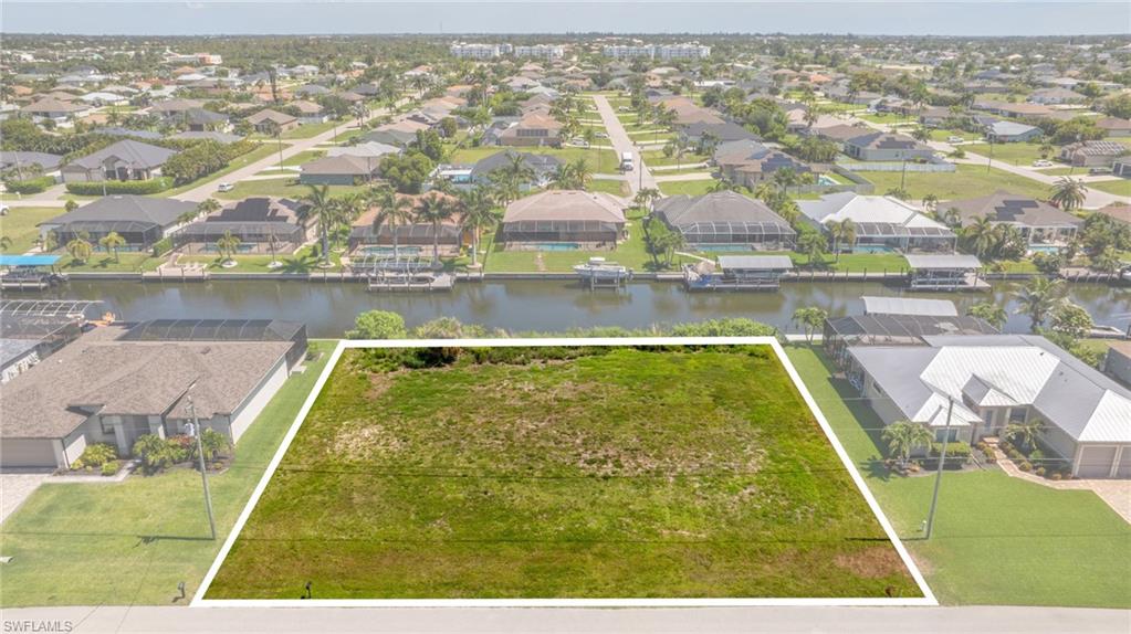 Rare opportunity to own an oversized Gulf-access waterfront property in Southwest Cape Coral! This exceptional offering includes a double lot consisting of four parcels, creating an incredible opportunity for homeowners, investors, and boating enthusiasts looking for space, flexibility, and waterfront living.

Situated on a wide saltwater canal with Gulf access, this property offers the ultimate Southwest Florida lifestyle. Enjoy approximately a 15-30 minute boat ride to open water, where world-class fishing, island hopping, waterfront dining, and endless days on the water await. Whether you're heading to Sanibel, Captiva, Fort Myers Beach, or simply cruising the local waterways, this location puts some of Southwest Florida's most beautiful destinations right at your fingertips.

The oversized property provides ample room to build your dream waterfront estate while still having space for all your toys. Construct a detached RV garage, boat garage, workshop, guest house, or additional storage building—all while maintaining a spacious yard for entertaining, recreation, or creating your own private resort-style oasis.

The expansive footprint sets this property apart from typical Cape Coral lots, offering endless possibilities for a custom pool, outdoor kitchen, fire pit, tropical landscaping, and extended outdoor living spaces. Whether you're looking to build a luxury waterfront residence, a seasonal retreat, or an investment property, the flexibility of this unique offering is unmatched.

Located in desirable Southwest Cape Coral, you'll enjoy convenient access to shopping, dining, entertainment, marinas, parks, and everything that makes Cape Coral one of Southwest Florida's most sought-after boating communities.

Properties offering this much land, Gulf access, and development potential are becoming increasingly rare. Bring your builder, your boat, and your vision. This is your opportunity to create the waterfront lifestyle you've always dreamed of with room to grow, play, and enjoy everything Florida living has to offer.