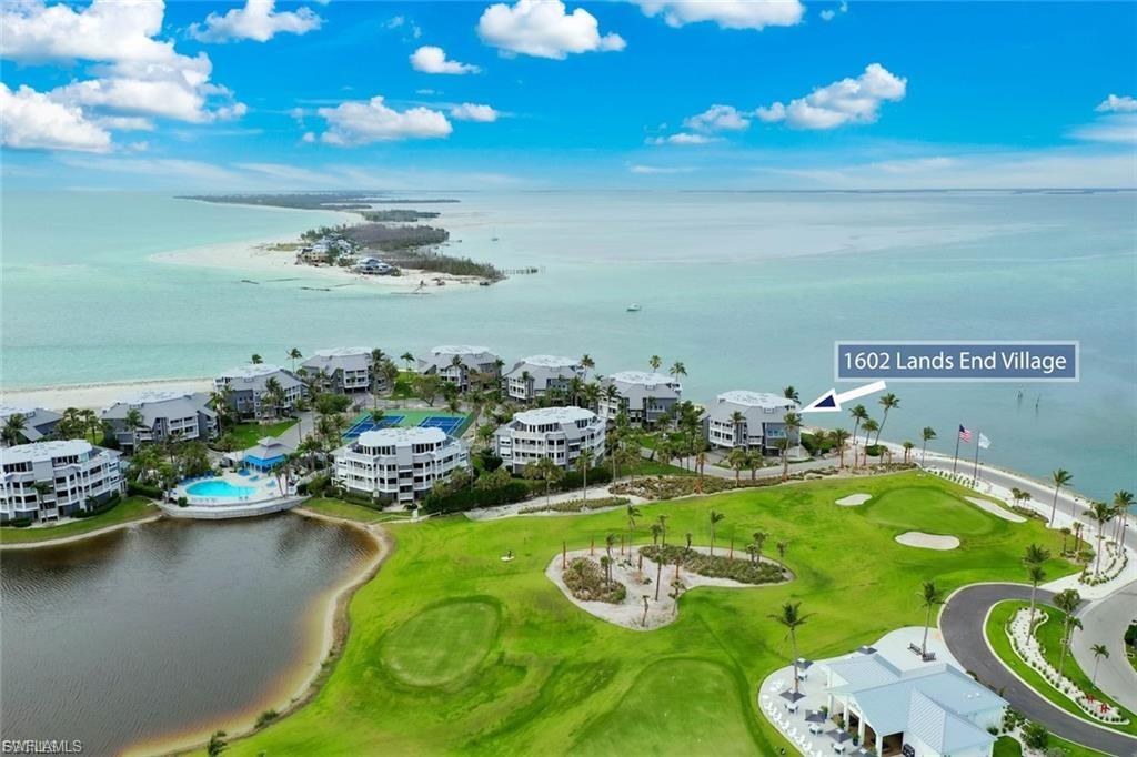 Perched at the northernmost point of Captiva Island, Lands End 1602 is a rare end-unit penthouse offering an unmatched combination of privacy, luxury, and breathtaking natural beauty. Located within the exclusive Lands End Village, this 3-bedroom, 3-bathroom residence overlooks the serene waters of Red Fish Pass, delivering sweeping 180-degree, unobstructed views of Pine Island Sound and beyond. Spanning over 2,300 square feet across two elegantly designed levels, the interior is bathed in natural light and finished in a serene palette of neutral tones. The open floor plan gracefully balances relaxed island living with refined entertaining, featuring a gourmet kitchen with rich wood cabinetry, granite countertops, a breakfast bar, dining areas. The spacious living and den areas seamlessly extend to an under air enclosed lanai and an expansive sundeck—perfectly positioned to capture both sunrise and sunset over Captiva’s breathtaking seascapes. Two guest bedrooms with en-suite baths and each with its own private terrace are thoughtfully situated on the main level, providing privacy and comfort for family and guests alike. Upstairs, the penthouse-level primary suite is a tranquil retreat framed by walls of glass showcasing panoramic coastal views. A large, private newly tiled deck invites moments of solitude under the stars, while the spa-inspired bath pampers with a jetted soaking tub, double vanities, sunlit skylights, and a walk-in shower. Additional comforts include under-building parking and storage, an upstairs laundry room, new roof, new AC, new irrigation and landscape lighting and tasteful furnishings offered with few exceptions. Beyond the residence, Lands End Village envelops you in the essence of resort-style island living. Enjoy direct beach access, a stunning updated association pool and hot tub surrounded by a sun-drenched patio with plush loungers, an outdoor shower, gas BBQ grills, a community house, tennis and pickleball courts and a private fitness center. Whether you’re seeking a serene personal sanctuary, a luxurious seasonal escape, or a high-potential investment, Lands End 1602 offers a rare opportunity to own one of Captiva’s most coveted penthouses—where nature, privacy, and timeless elegance converge. offered furnished with all custom curtains and Hunter Douglas blinds included. Current rentals to be honored. This is island living at its absolute finest.