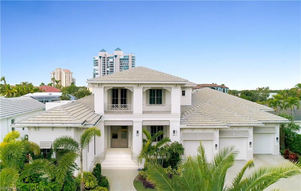 This exceptional home is located on a quiet dead-end street on a canal in the charming area of Seagate where boats can navigate through Clam Pass to the Gulf. Designed by Boyatt Designs, this free-flowing open floor plan features a gourmet kitchen, great room, dining area and spacious outdoor living space. Large hurricane-rated sliding doors open the home completely to the outside. The main floor master suite features a beautiful large marble bath with his/her vanities, 2 showers, tub, separate water closet and his/hers walk-in closets. Off the kitchen is a wet bar and a dining area, 3 wine coolers and a walk-in pantry. In addition, there is a one-bedroom suite, a powder room, and an office/den along with another full bath which also functions as the pool-bath on the main floor. Upstairs features a large loft, 2 bedrooms with full baths and walk-in closets, a wet bar and a balcony offering great views of the canal as well as Clam Bay! The exterior features a new seawall, 10’ x 60' Dock, 7500 lbs. electric boat lift, gas powered heated salt water pool/spa, electronic screens & 3 car garage.  Within walking/biking distance to beach club, parks, shopping and schools.
