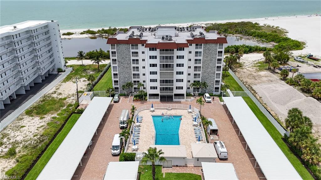 Create your dream coastal retreat in this ideally located 2-Bedroom, 2-Bath residence on the south end of Fort Myers Beach, offering convenient on-and-off island access. Enjoy breathtaking GULF and lagoon views, Hurricane-Impact Windows and Doors, and the rare opportunity to customize the interior to your personal style, starting with a blank canvas. Lowe’s Shenandoah Pro Kitchen cabinetry is included and on-site (not yet installed), providing a head start on creating your ideal space.  Whether you’re looking for a full-time residence, vacation getaway, or investment property, with a 14-day minimum rental policy, it also offers excellent income potential.  Sand Caper is a Gulf-front community featuring a large resort-style pool, outdoor grilling area, and direct access to miles of sugar-sand beach. Located within walking distance of shops, restaurants, and Santini Marina Plaza, this exceptional property combines an unbeatable location with endless possibilities.