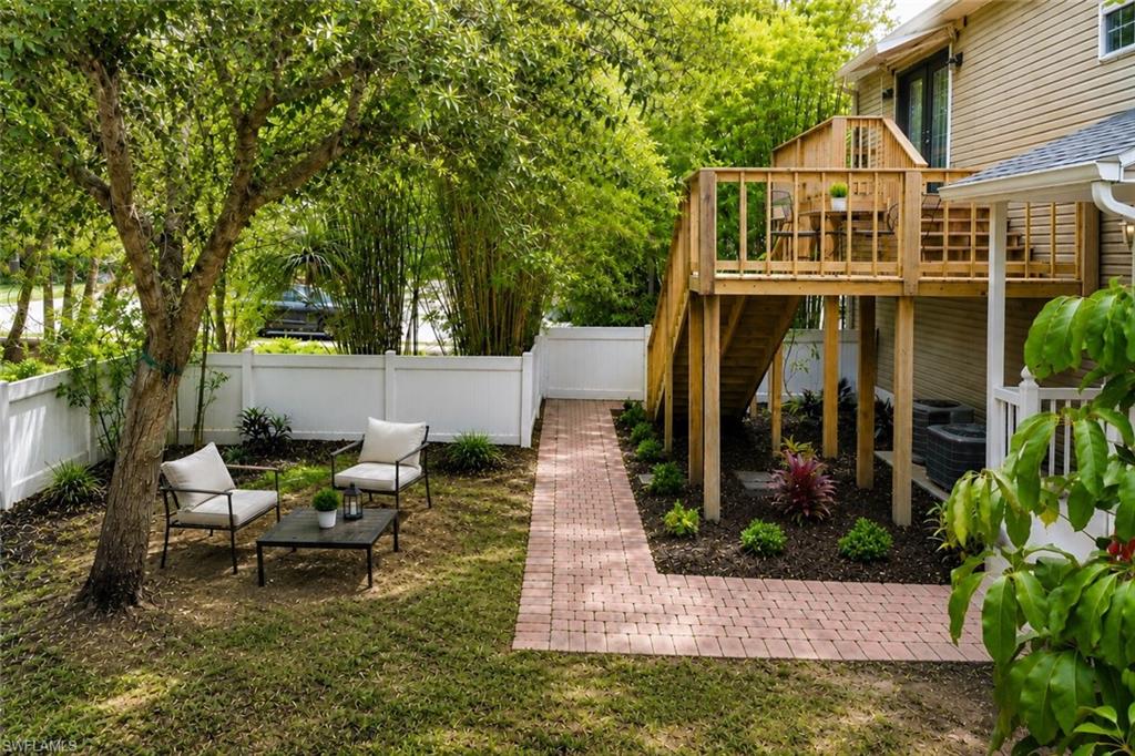 UPDATED HOME WITH FULLY FENCED BACKYARD - BRAND NEW ROOF & LOW HOA FEES! Welcome to this move-in-ready home in the desirable Leawood Lakes community, offering over 2,000 square feet and ONE OF THE LARGEST FLOOR PLANS in the neighborhood. With 3 bedrooms and 3 full bathrooms, this spacious residence provides a versatile layout that's ideal for families, multigenerational living, or as an investment opportunity. Major improvements include a BRAND-NEW ROOF (2026), NEW LVP FLOORING IN ALL BEDROOMS (NO CARPET!), NEW INTERIOR PAINT, and NEW LANDSCAPING, giving the home a fresh, modern feel inside and out. Featuring TWO PRIMARY SUITES —one on the first floor and another on the second—this home is perfectly designed for those seeking flexibility and privacy. The first-floor primary suite includes a spacious bedroom, private bathroom, walk-in closet, and a versatile den/kitchenette area with its own private access to the backyard. Upstairs you’ll find the second primary suite, an additional bedroom, two full bathrooms, and an open-concept living, dining, and kitchen area. A private balcony off the upstairs living area features stairs leading directly to the backyard, creating a seamless indoor-outdoor living experience. Step outside to enjoy a spacious, fully fenced backyard with upgraded landscaping, offering plenty of room for pets, outdoor entertaining, gardening, or future enhancements. Additional highlights include a 1-CAR GARAGE, PAVER DRIVEWAY, generous storage, and a functional floor plan designed for comfortable everyday living. Residents of Leawood Lakes enjoy a beautifully maintained community with LOW HOA FEES and access to a community pool, all while being conveniently located JUST MINUTES FROM DOWNTOWN NAPLES, 5th Avenue South, Naples' white-sand beaches, shopping, dining, and only about 6 minutes to I-75, providing easy access throughout Southwest Florida. With an unbeatable Naples location and exceptional versatility, don't miss this exceptional opportunity to own one of the largest homes in Leawood Lakes! THIS PROPERTY QUALIFIES FOR A 1% LENDER INCENTIVE IF USING PREFERRED LENDER, INQUIRE FOR MORE DETAILS** (Renderings that showcase furniture have been virtually staged)