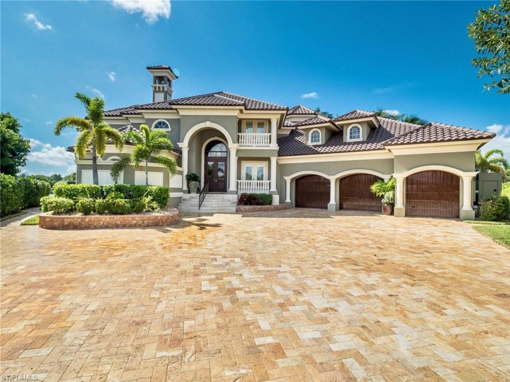 Exquisite Custom Home with Direct Gulf Access in the prestigious Deep Water Yachting Community of Palmetto Point. Over 200 linear feet of water frontage with 2 boat lifts, 24,000 LB and 10,000 LB, triple jet ski lift and a floating dock for your yacht. Situated on a point, there are water views from virtually every room overlooking a wide, protected basin and canal. The Pool and Lanai rival any luxury resort with negative edge pool, 2 outdoor kitchens, swim up bar, integrated spa, & fire features. The Sellers have spent over $1.2M over the past 2 years upgrading the home to the highest standards - travertine and hardwood flooring throughout; coffered, inlaid ceilings; commercial grade appliances; detailed custom cabinetry; carved stone gas fireplace; newly painted interior and exterior; New Roof 2019; all hurricane impact windows and doors. Massive 3 car garage for all the toys and an air conditioned boat room for all your boating gear. Whole home generator. - complete feature and cost list plus additional photos available upon request. This home will satisfy the most discerning Buyer who is looking for unsurpassed quality and understated elegance.